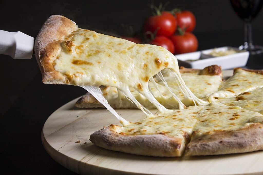 cheese-pizza-being-served